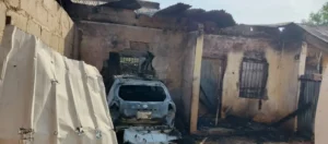 Jigawa, vehicle accident, woman and children, house fire, reckless driving, Police Public Relations Officer, DSP Shi’isu Adam, alcohol influence, Toyota Corolla, residential damage, firefighting efforts, good Samaritans, festive season safety, vehicle crash, road safety, Jigawa State news, community response, police investigation, public safety